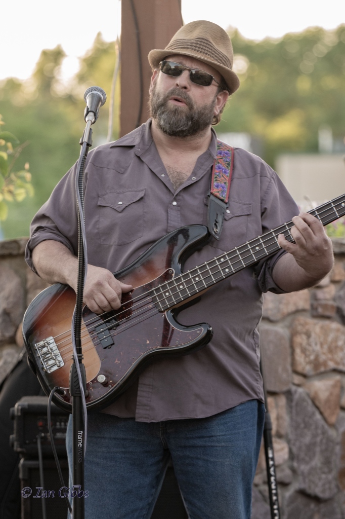 Dean Wolfson playing bass on stage